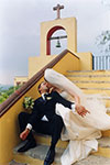 a wedding kiss on the steps